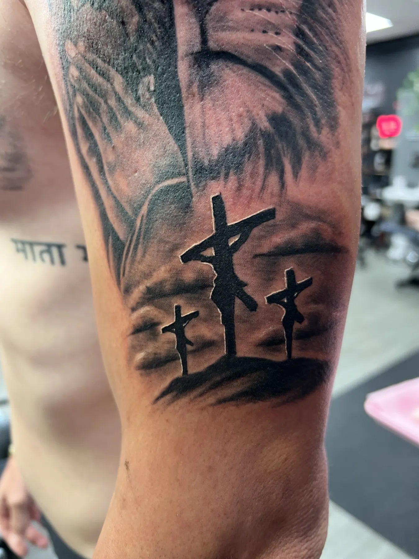 Calvary Crosses Arm Tattoo