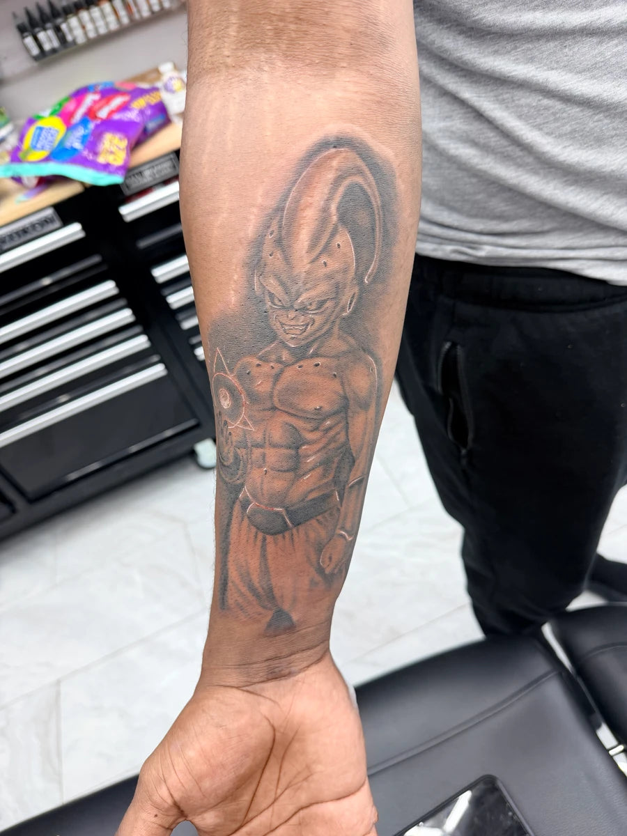 Black and Grey Majin Buu Anime Forearm Tattoo