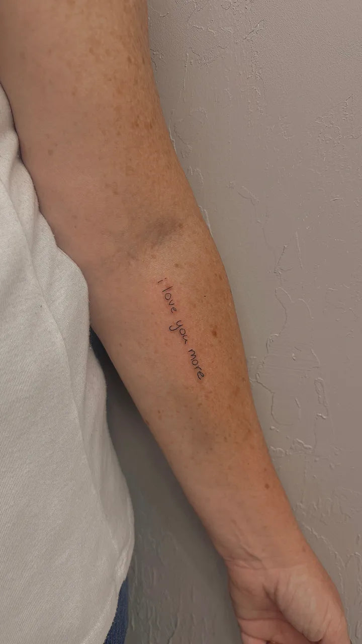 I Love You More Script Forearm Tattoo