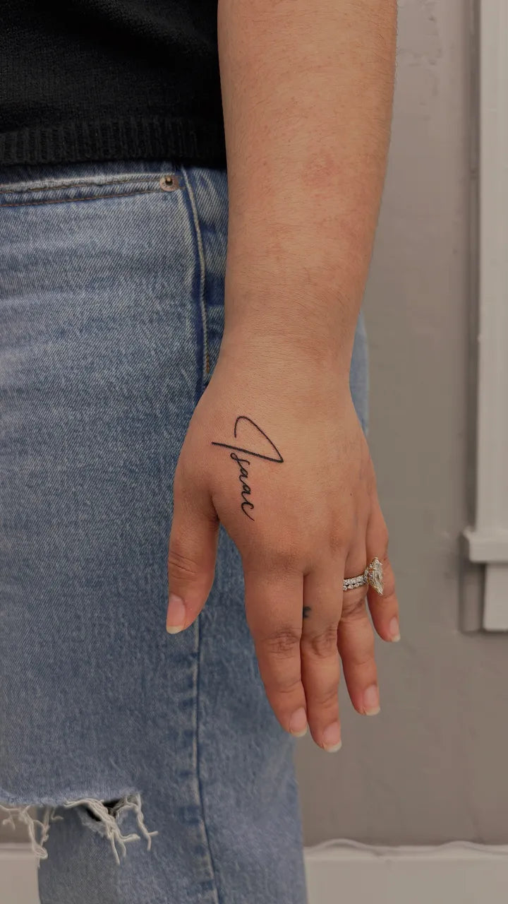 Isaac Script Hand Tattoo